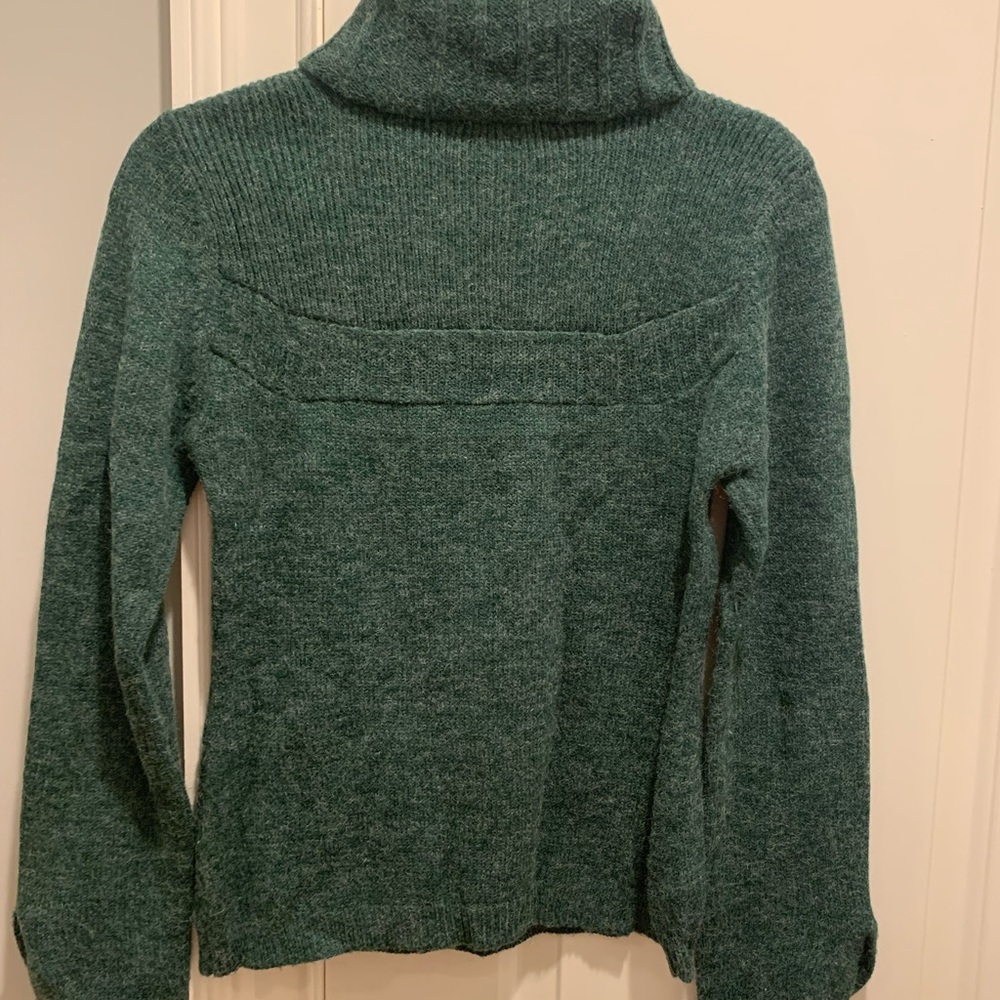 Women’s green embellished turtleneck sweater